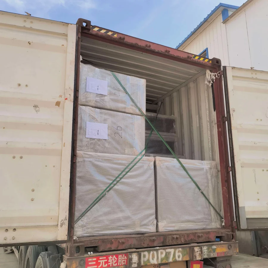 Stackable outdoor dining chairs packed on pallets and loaded into export shipping container at YardAve factory