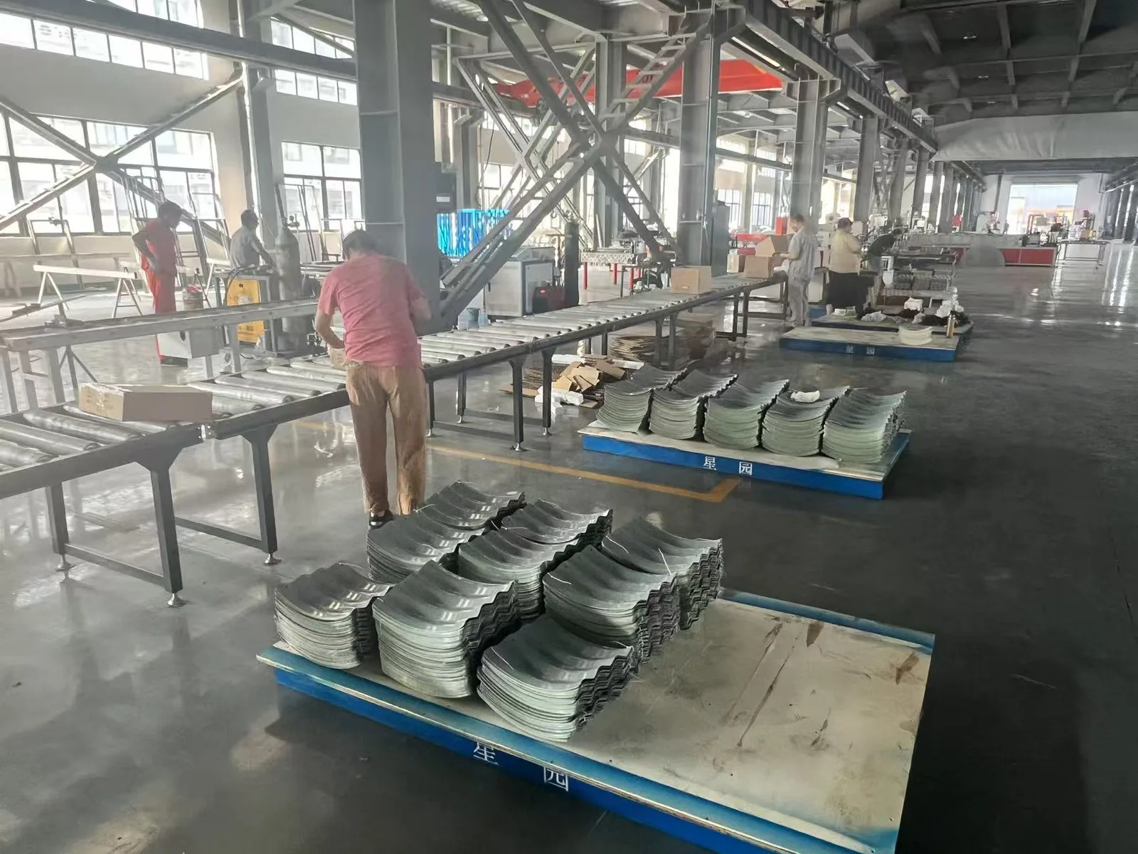 Raised garden bed manufacturers producing corrugated metal garden bed panels inside the YardAve factory